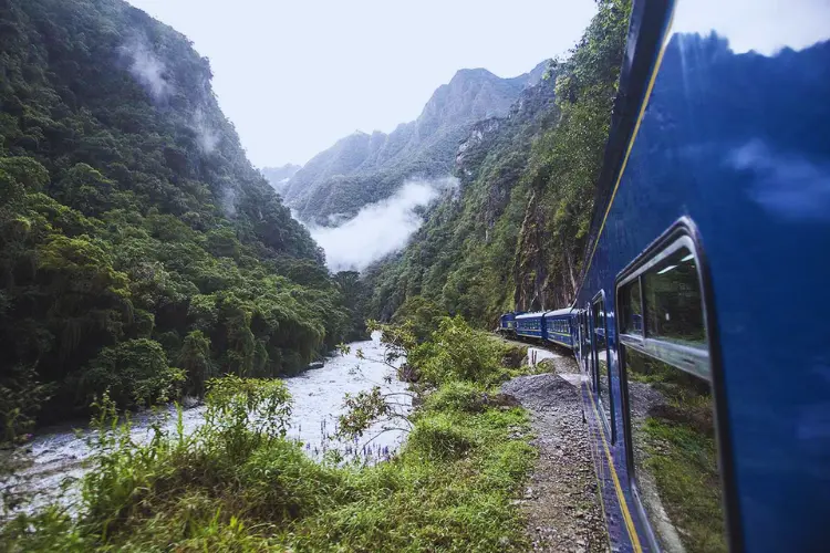 Scenic train journey to Machu Picchu through the lush landscapes of the Sacred Valley.