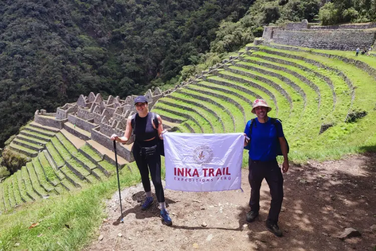 Wiay Wayna terraces and ruins surrounded by lush Andean mountains.